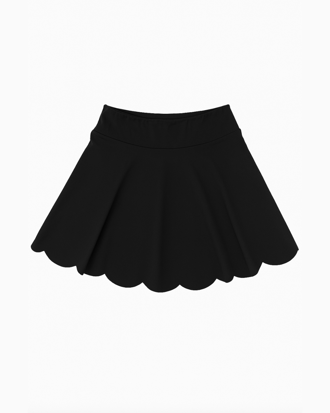 Flat lay de The Edge Skirt negro de Muv&Glow sobre fondo blanco, falda deportiva con acabado ondulado.