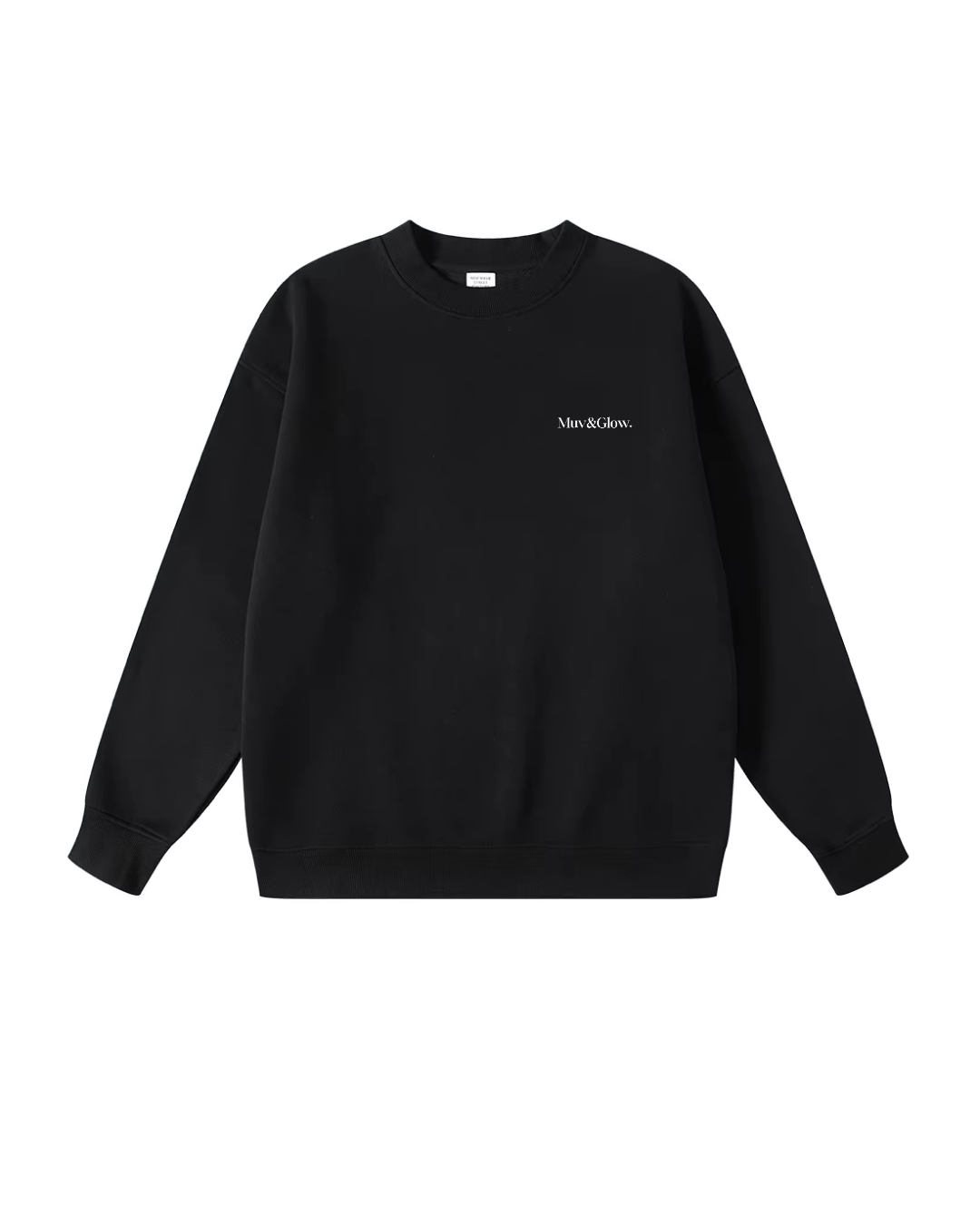 Flat lay del Essential Pullover negro de Muv&Glow sobre fondo blanco, sudadera básica con corte oversize.