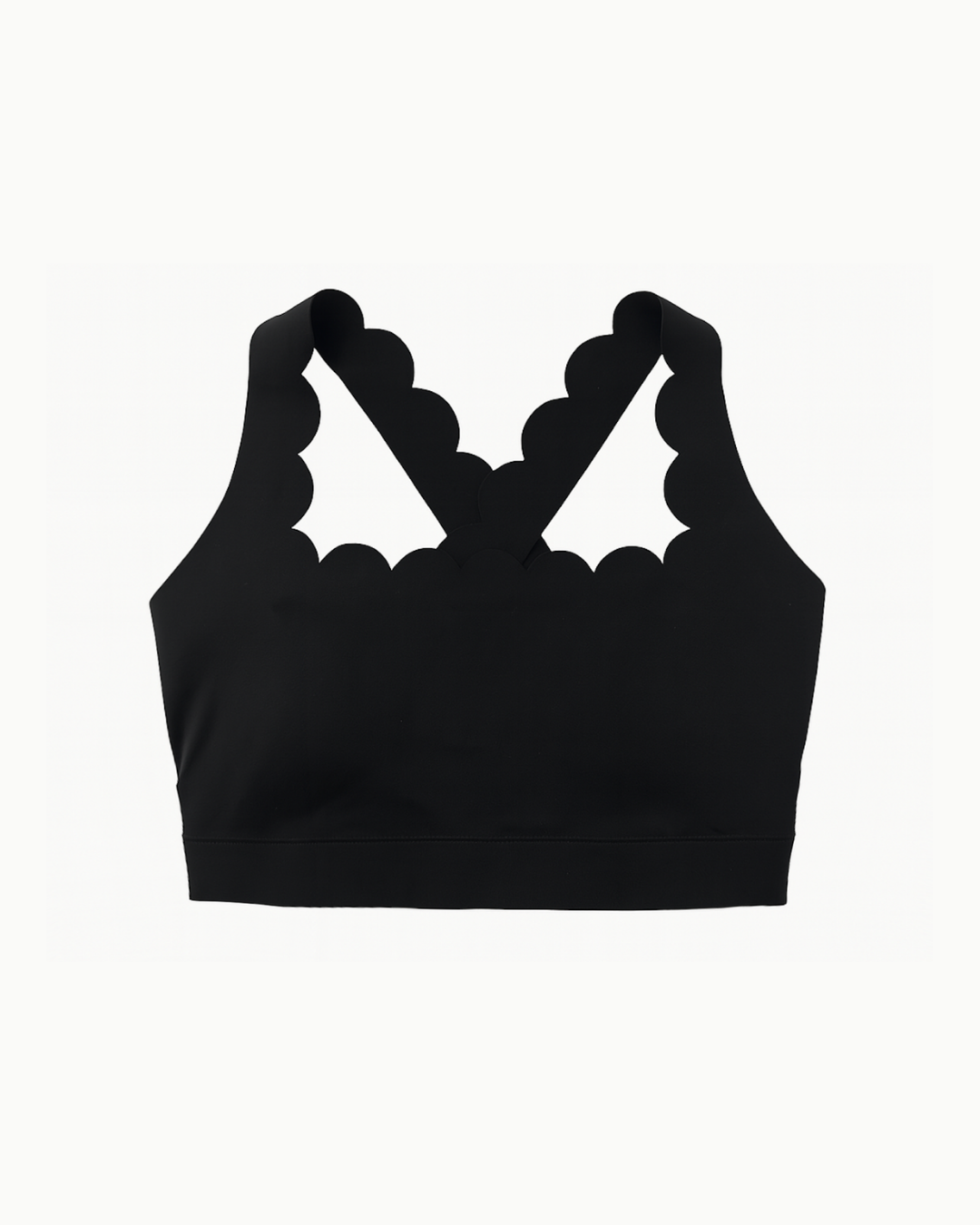 Vista flat lay del top deportivo The Edge Bra negro de Muv&Glow.
