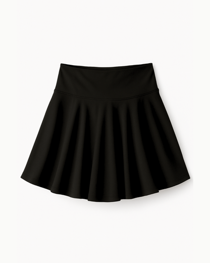 Flat lay de The Core Skirt negro de Muv&Glow sobre fondo blanco, falda deportiva con short interior.
