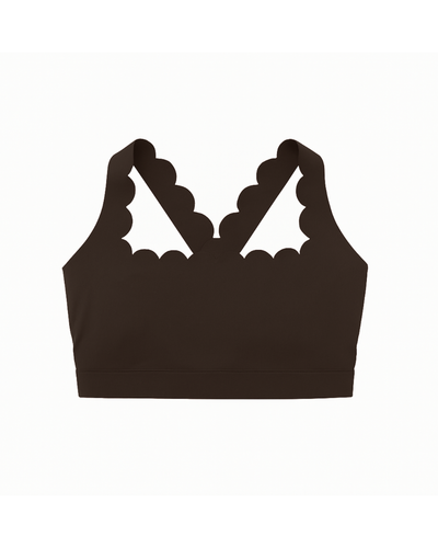 Flat lay del The Edge Bra espresso de Muv&Glow sobre fondo blanco.
